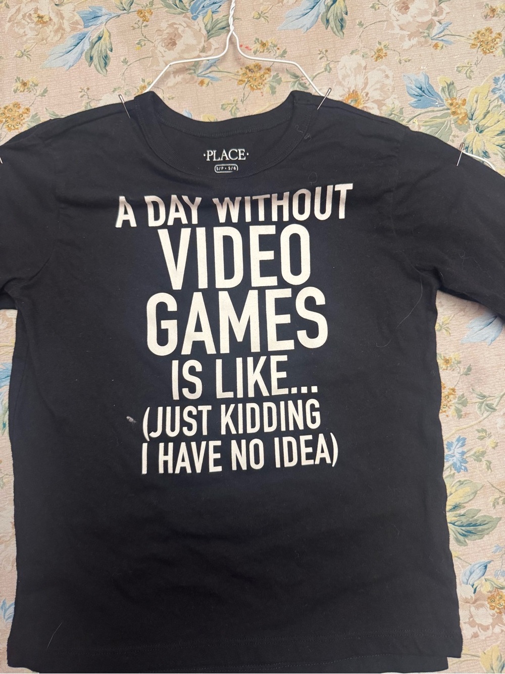 Place Black Tee with White "A Day Without Video Games" Graphic